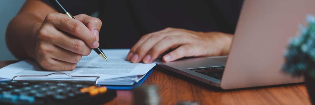 Someone signing a contract